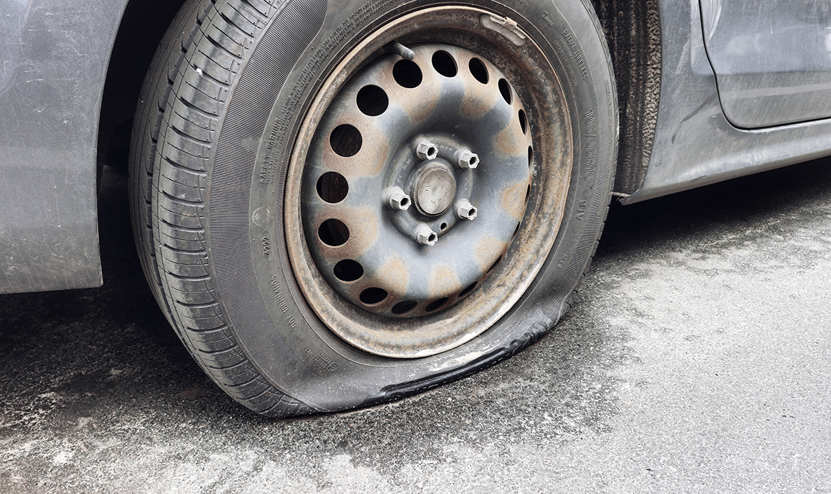 Damaged wheel on car