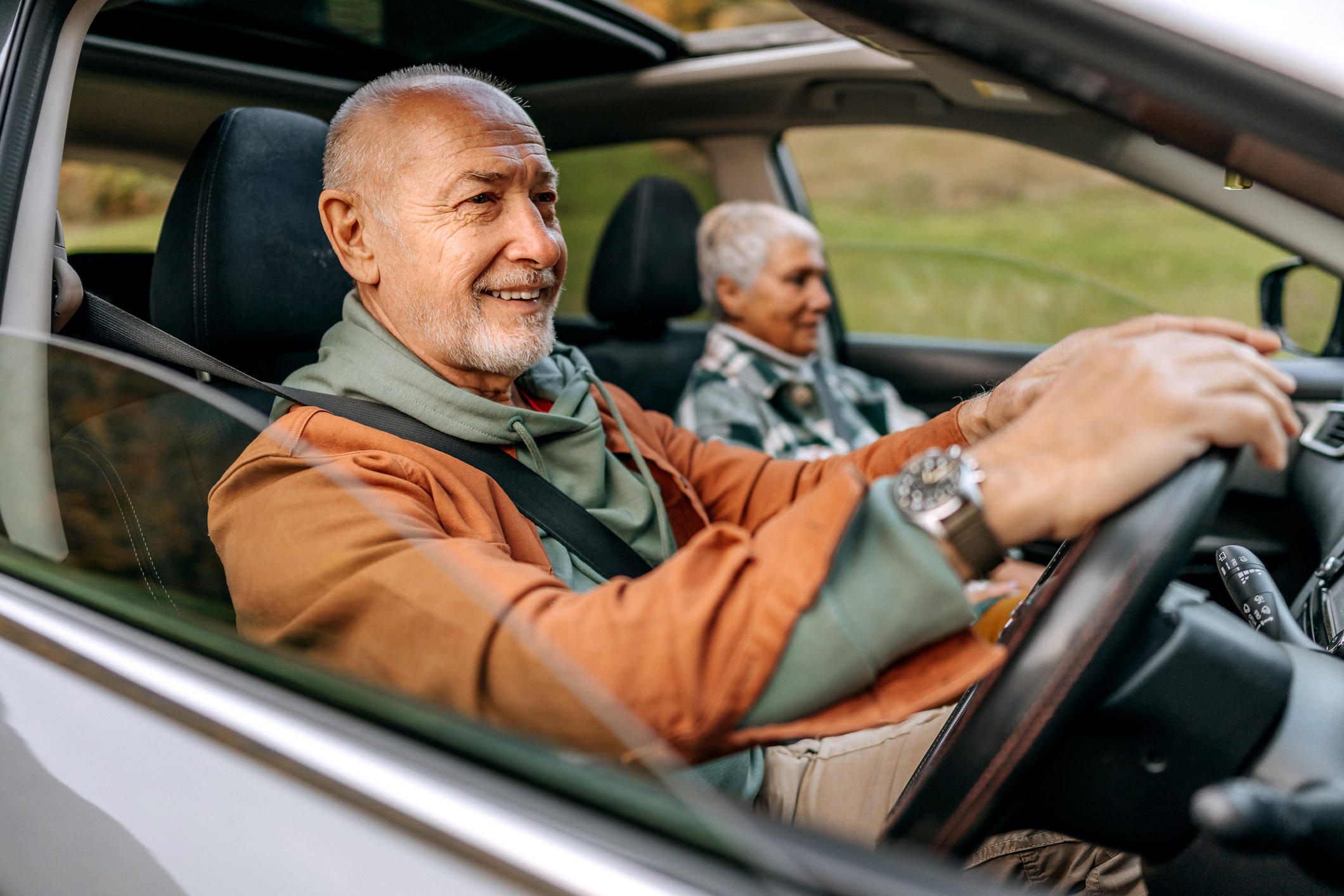 Senior couple on a road trip in a car together