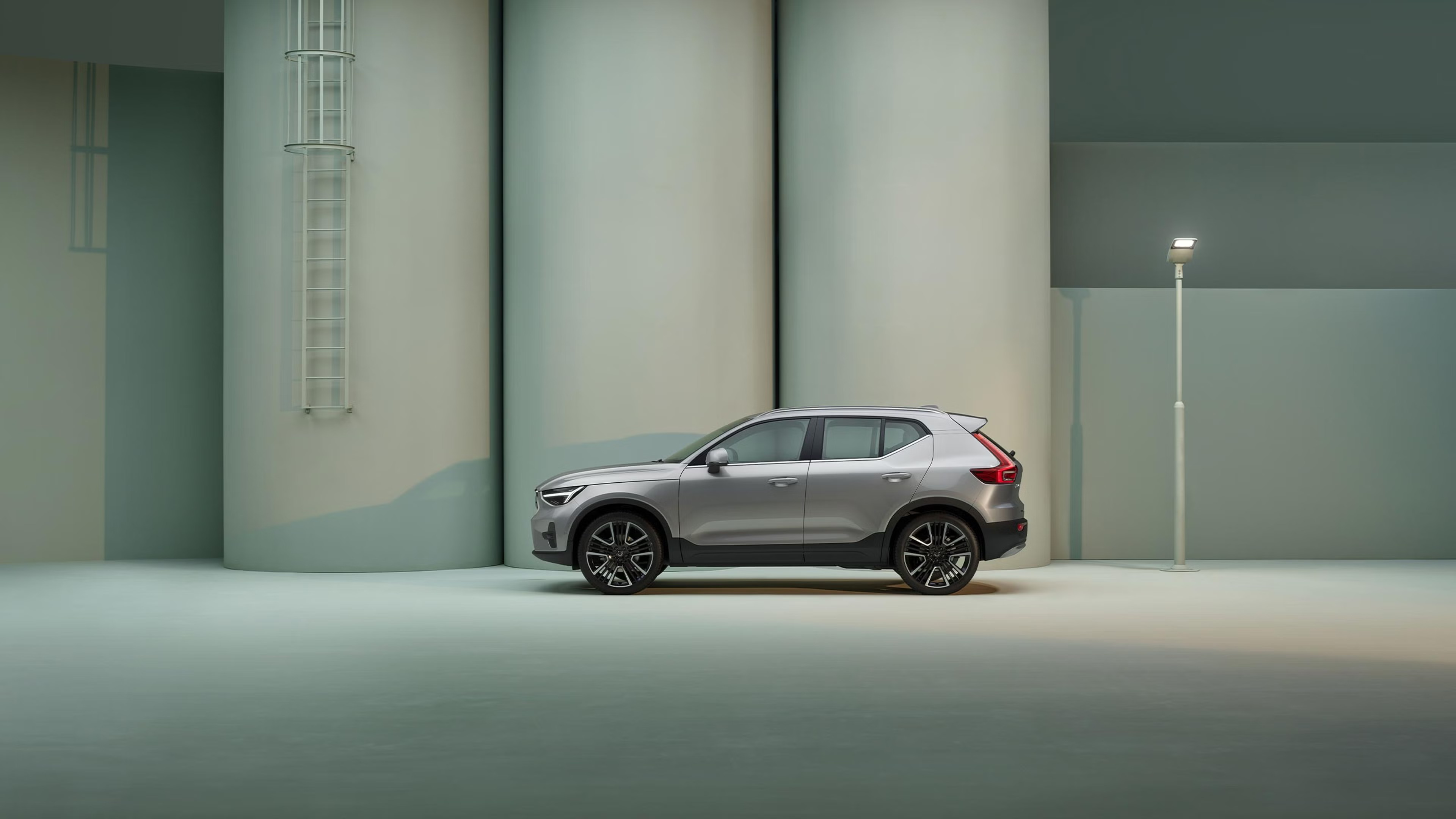 Left side view of a Silver Volvo XC40 parked in an industrial area