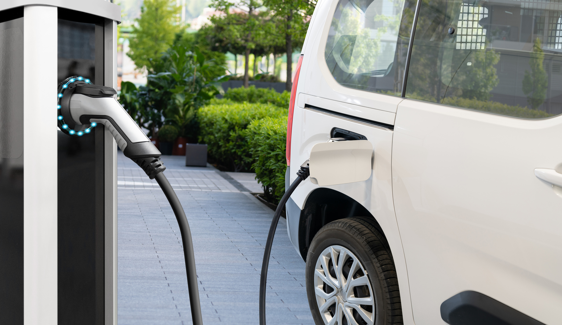 Electric delivery van with electric vehicles charging station.