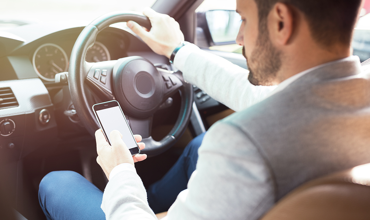 Risks and Penalties of Using Handheld Devices Behind the Wheel