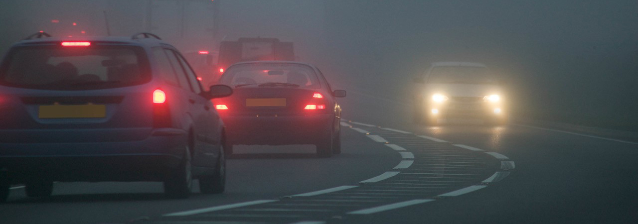 cars driving in fog